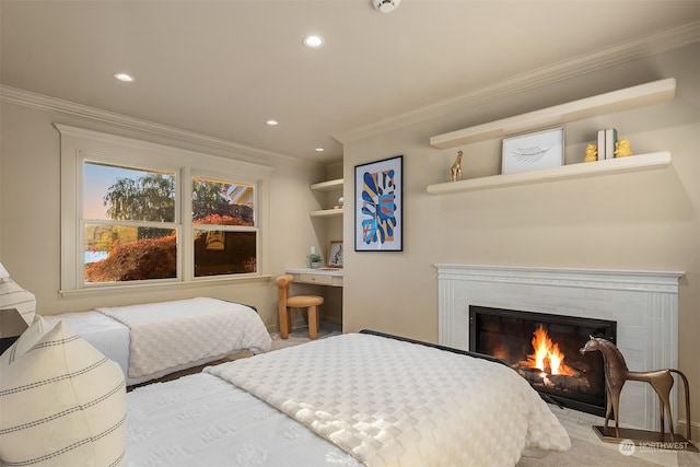 bedroom featuring a brick fireplace and crown molding