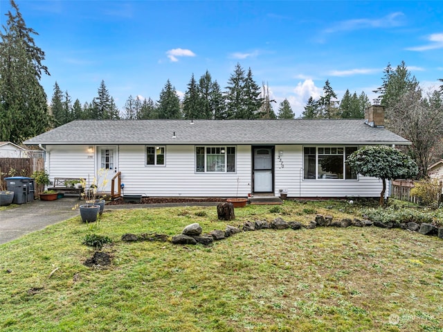 ranch-style house featuring a front lawn