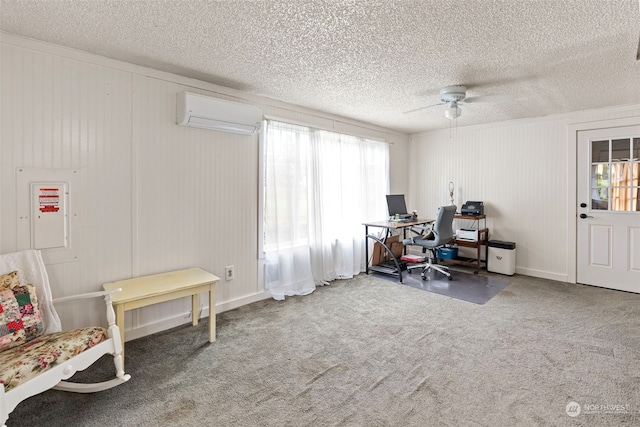 carpeted office with a textured ceiling, ceiling fan, and a wall mounted air conditioner