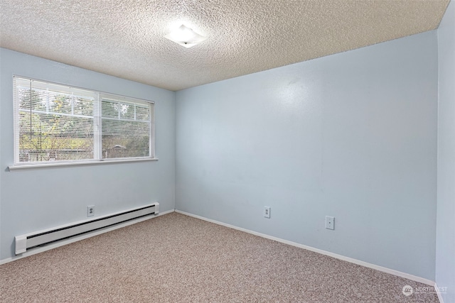 spare room with a textured ceiling, carpet floors, and baseboard heating