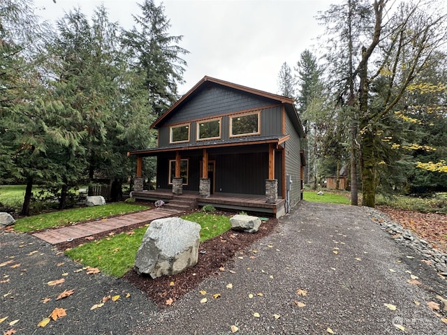 111 Heather Pl, Packwood, WA 98361 - view of front of home featuring a porch, stone siding, and driveway