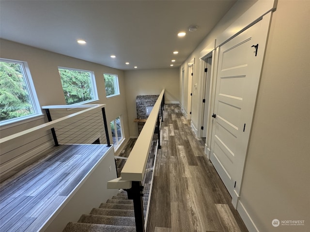 stairway with hardwood / wood-style flooring