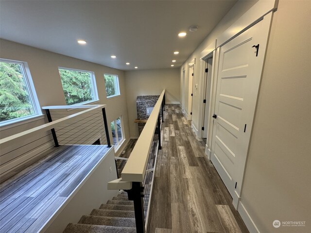 111 Heather Pl, Packwood, WA 98361 - hall with dark wood-style floors, recessed lighting, an upstairs landing, and baseboards