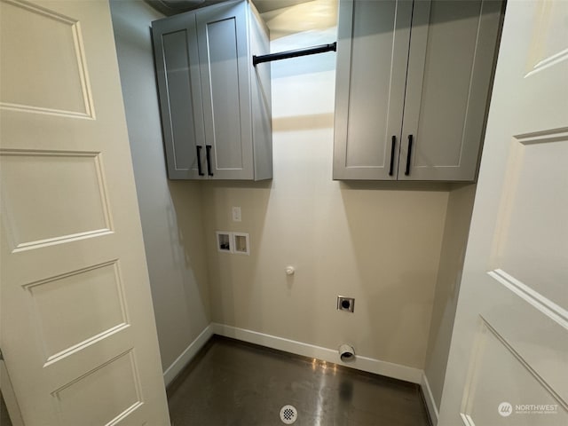 washroom featuring hookup for a gas dryer, hookup for an electric dryer, washer hookup, and cabinets