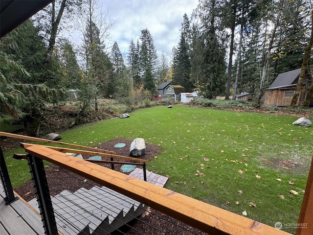 view of yard with a wooden deck