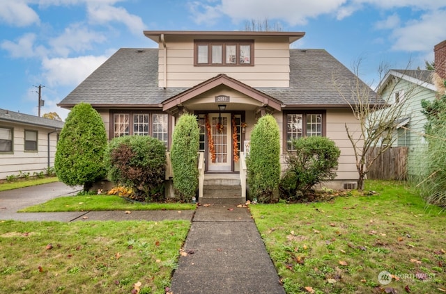 bungalow-style house with a front yard