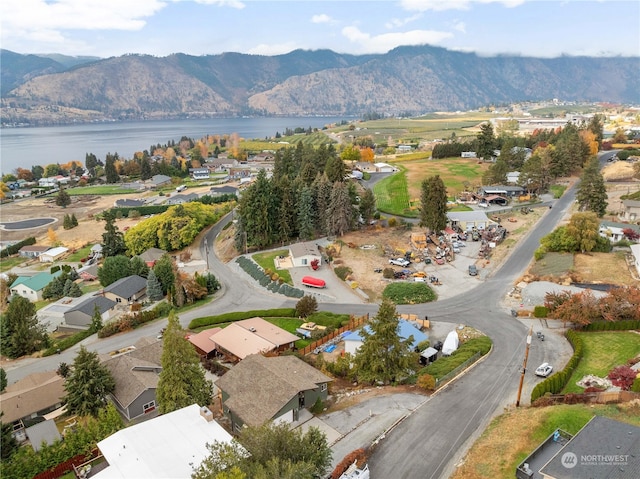 bird's eye view featuring a water and mountain view