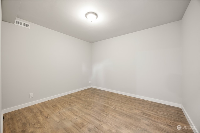 empty room with light hardwood / wood-style floors