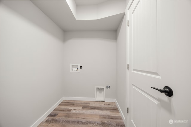 laundry room featuring light hardwood / wood-style flooring, washer hookup, and electric dryer hookup