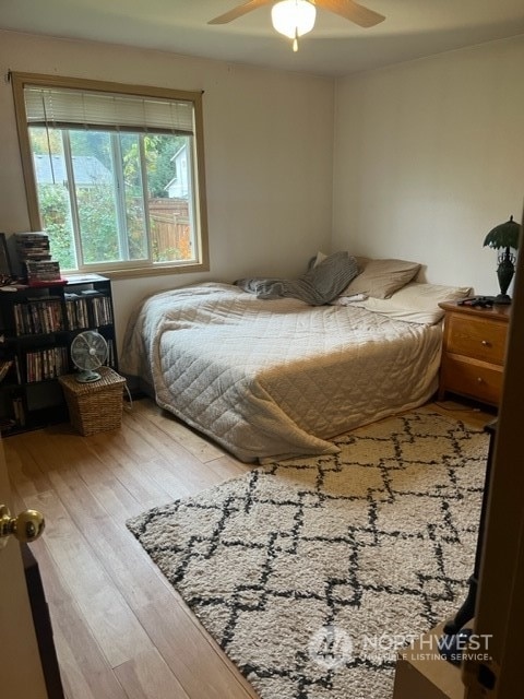 bedroom featuring hardwood / wood-style floors and ceiling fan