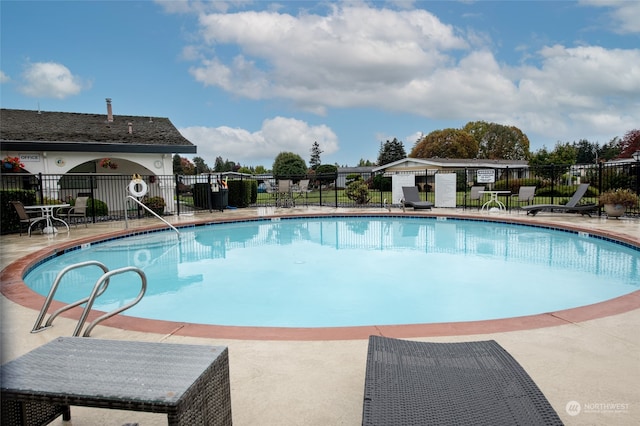 view of swimming pool featuring a patio