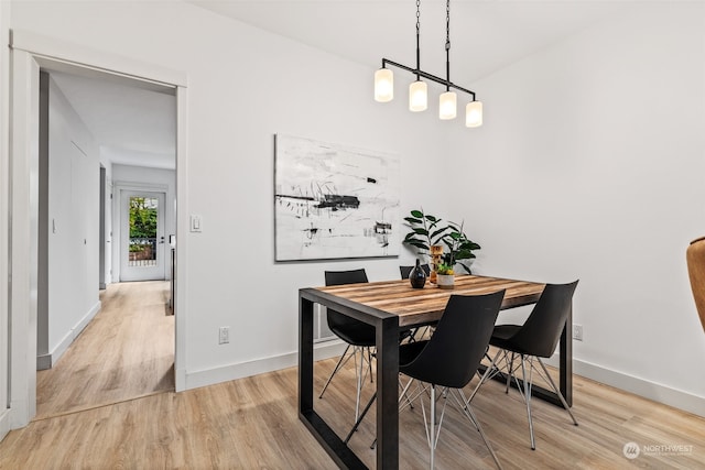 dining space with light wood-type flooring