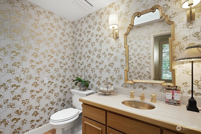 bathroom with vanity and toilet