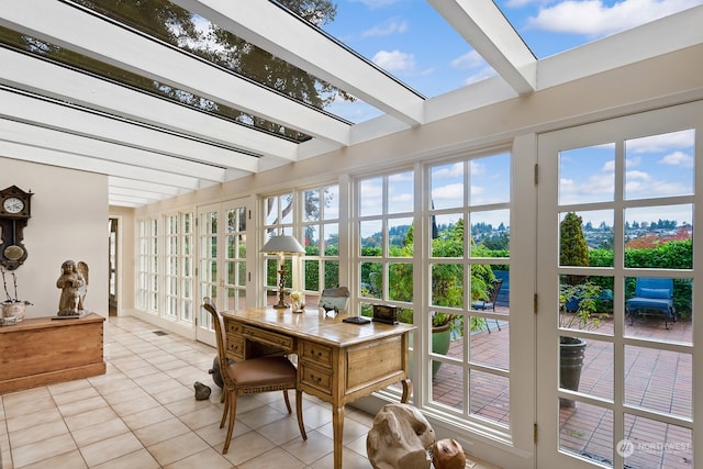 sunroom featuring a skylight