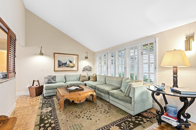 living room featuring high vaulted ceiling and light parquet floors