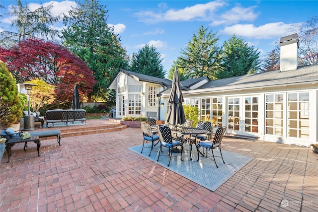 view of patio featuring french doors and an outbuilding