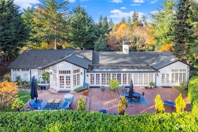 back of house with a patio area and french doors