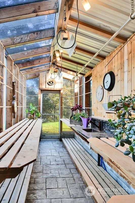 interior space featuring vaulted ceiling with beams