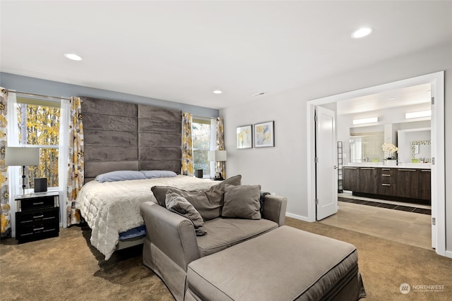 carpeted bedroom with ensuite bathroom