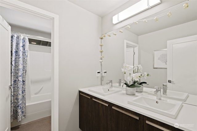 bathroom featuring shower / tub combo with curtain and vanity