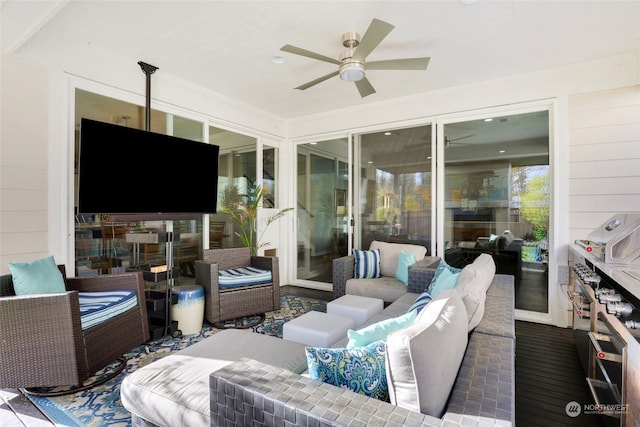 view of patio / terrace with ceiling fan and an outdoor living space