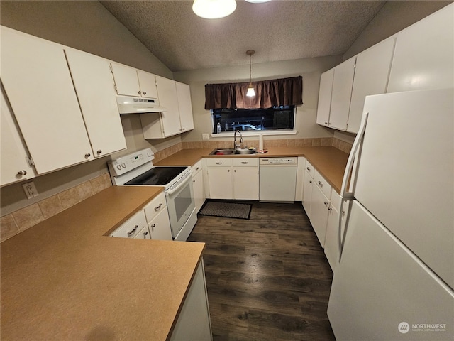 kitchen with white cabinetry, hanging light fixtures, white appliances, and sink