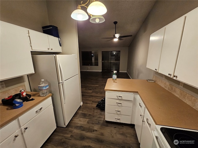 kitchen featuring white cabinetry, dark wood-type flooring, ceiling fan with notable chandelier, and decorative light fixtures