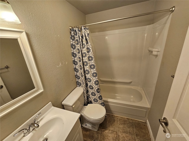 full bathroom with vanity, shower / bath combo with shower curtain, and toilet