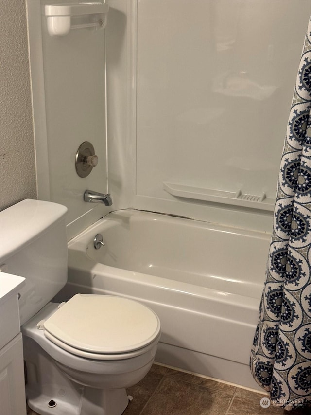 full bathroom featuring vanity, toilet, and shower / bathtub combination with curtain