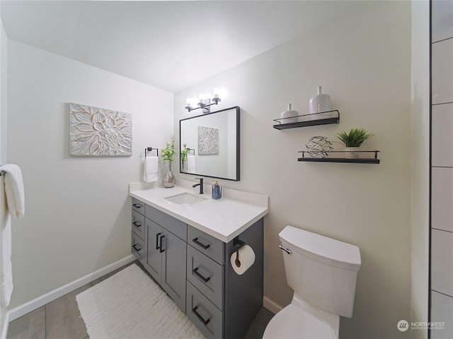 1250 Taylor Ave N Unit 205, Seattle, WA 98109 - bathroom featuring vanity, toilet, and baseboards