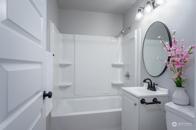 full bathroom featuring tub / shower combination, vanity, and toilet