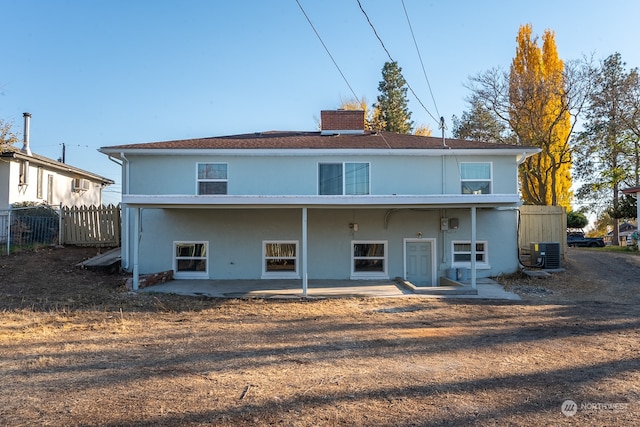 back of property featuring a patio and central AC