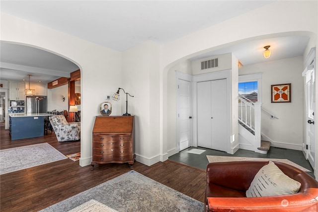 entryway with dark hardwood / wood-style floors