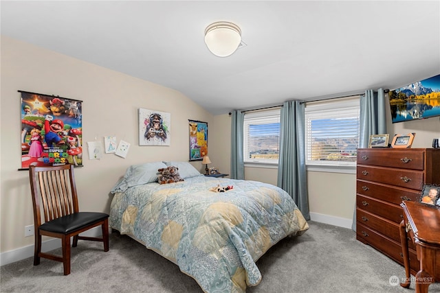 carpeted bedroom with vaulted ceiling