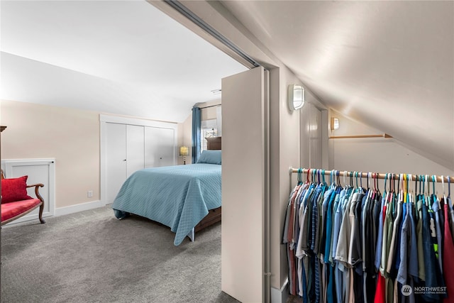 carpeted bedroom with vaulted ceiling