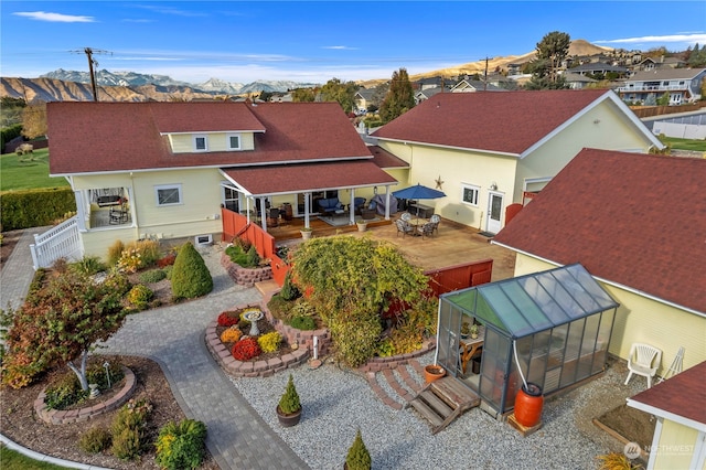 birds eye view of property with a mountain view