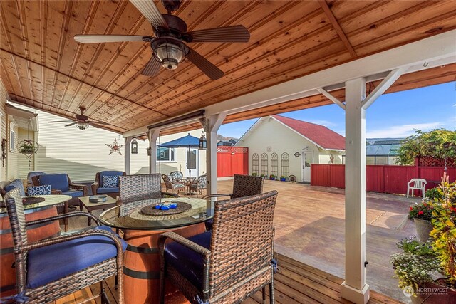 deck with ceiling fan and a storage unit