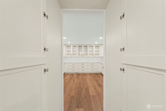 corridor with light wood-style flooring