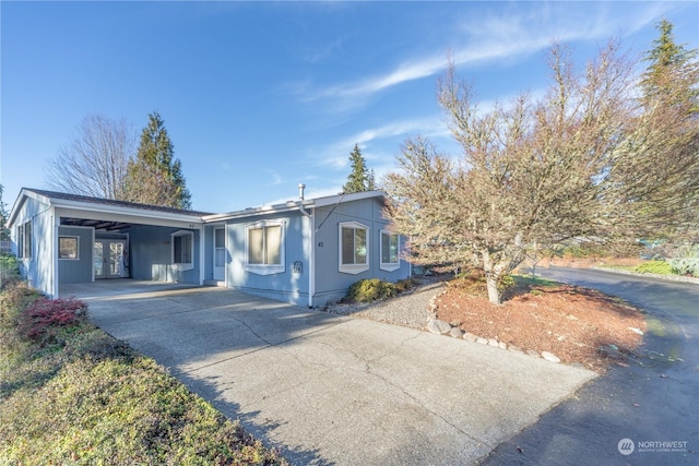 single story home with a carport