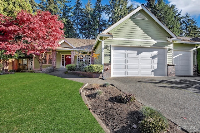 view of front facade featuring a front lawn and a garage