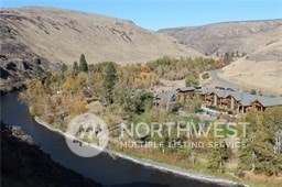 property view of mountains featuring a water view