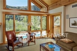 sunroom with wood ceiling and lofted ceiling