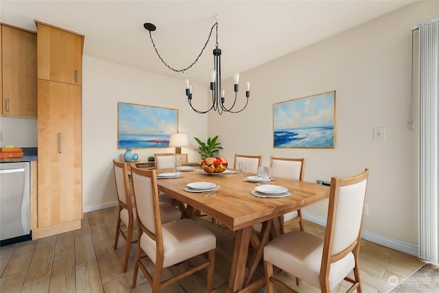 dining space featuring hardwood / wood-style flooring and an inviting chandelier