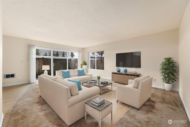 5021 Ripley Ln N Unit 112, Renton, WA 98056 - living room featuring baseboards and light wood-style flooring