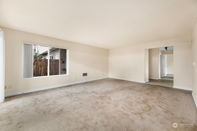 unfurnished room featuring carpet flooring