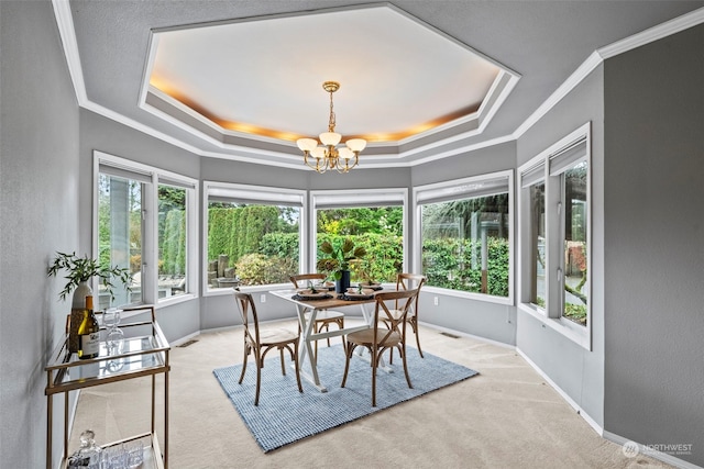 sunroom / solarium featuring a chandelier and a tray ceiling