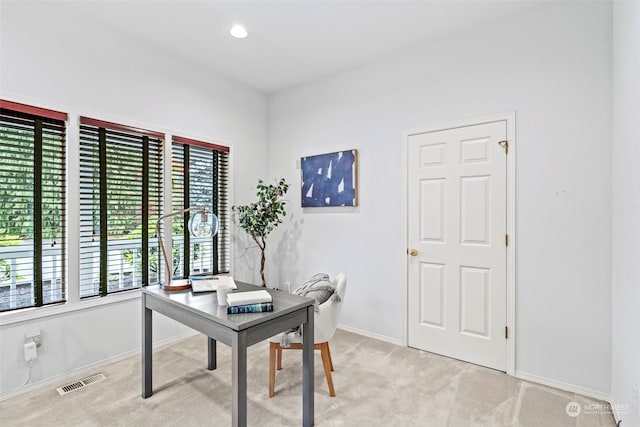 office area with light colored carpet