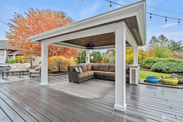 wooden deck featuring outdoor lounge area and a gazebo