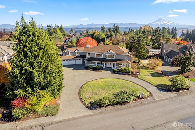 birds eye view of property featuring a mountain view