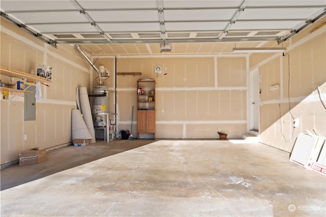 garage with a garage door opener and gas water heater